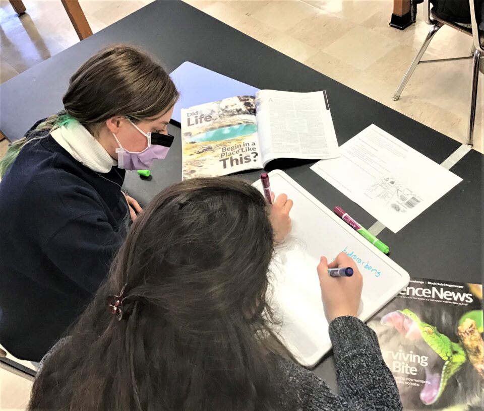 Shows a teacher using SNHS resources in the classroom during the pandemic